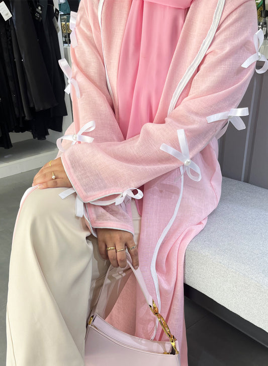 Indulge in Luxury with Our Pink Collection: A Pearl-Embellished Ribbon Bisht Abaya | Bsi4013